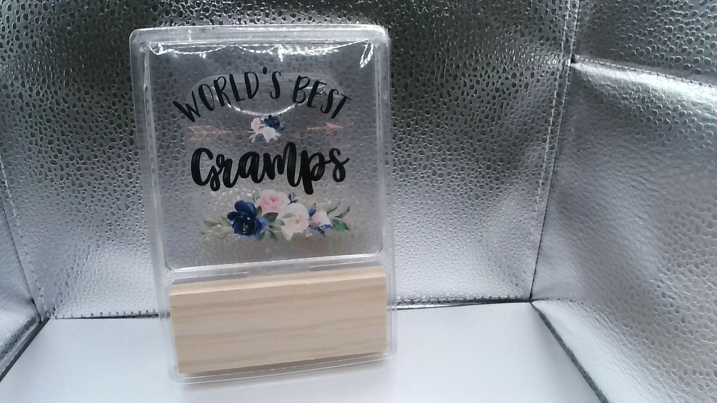 World's Best Gramps Sign - Clear Plastic with Wooden Holder